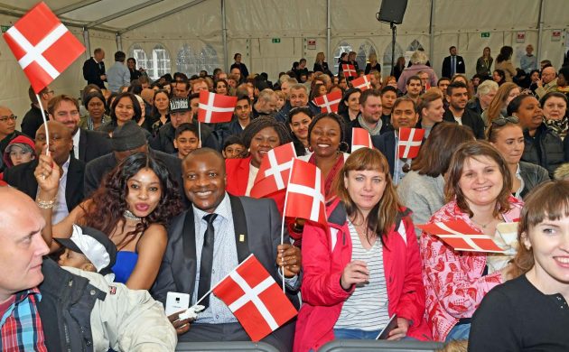 New Danes celebrate upon receiving their passport.